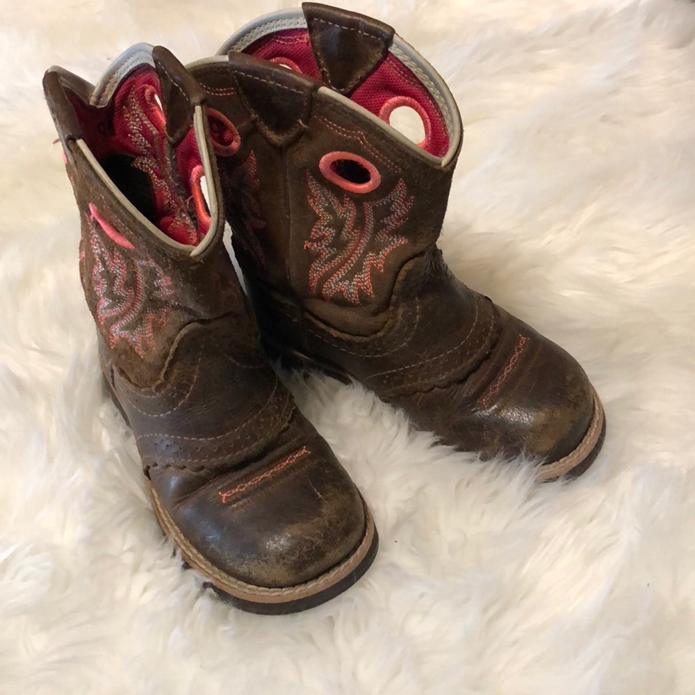 Girls Ariat boots.
